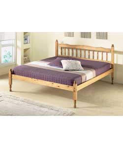 Solid pine in antique finish. Shaped headboard with sculptured posts and turned spindles. Size (W)14