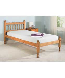 Solid pine in antique finish. Shaped headboard with sculptured posts and turned spindles. Size (W)99