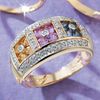 9ct Gold flower design ring set with diamonds and blue, pink and yellow sapphires.