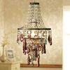 A rainbow of colours make up this eye-catching glass chandelier. Non-electrical. Max 100W. Measures: