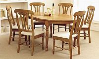 Extending oval table and four upholstered chairs.H