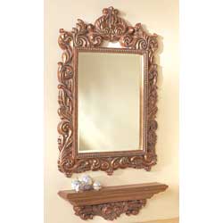 Both crafted in polyresin, our luxuriously gilded mirror frame and shelf are the epitome of Louis