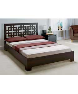 Chocolate-coloured bed with decorative headboard and pine slatted base. Includes luxury firm