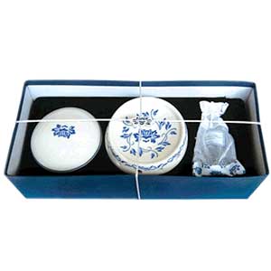 The oil burner dish has a matching lid that when fitted together makes a sphere.  The lid is