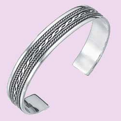 A silver bangle with an intricate plait design.925 Sterling Silver