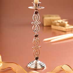Scrolling interlaced motifs derived from Celtic designs decorate these graceful nickel-plated