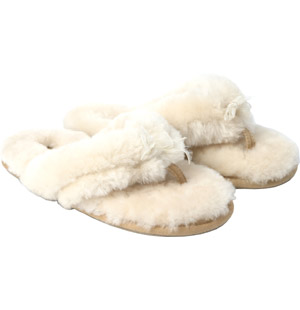 Pfluffy, toe thong sheepskin fur slipper with bow detail.