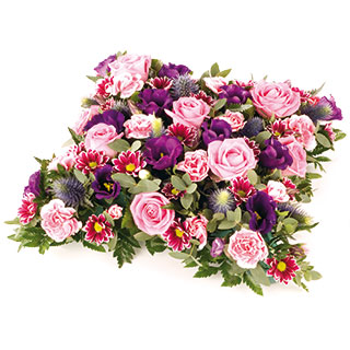 A lovely open cushion in shades of blues and pinks.