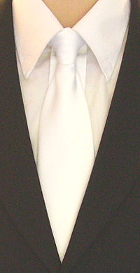 A plain white clip-on tie with a smooth, satin finish.