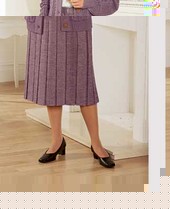 Warm handle check skirt. Permanent box pleats. Elasticated waist. Self tailored belt. Machine washab