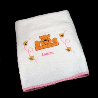 Winnie the Pooh  every childs favourite. This bath and hand towel set can be personalised with