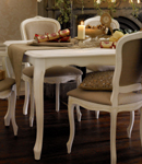 Elegant, French-style, dining table with extension leaf in hand painted brushed finish with a light 