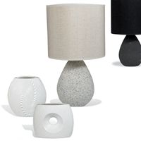 Available in 2 colourways, this handy table lamp has a ceramic base in a pumice stone-effect finish
