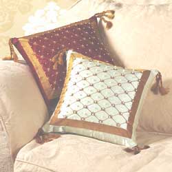 Dainty 100% silk satin cushions embroidered with gold thread and beads to mirror the richness of