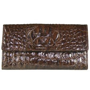 A convenient travel wallet from Jones Bootmaker. Features faux crocodile skin, five separate compart