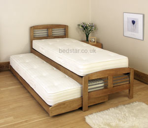 The Santorini Solid wood and metal guest bed. The storaway bed is mounted on sprung wooden legs to