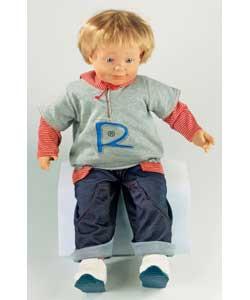 Huggable attractive toddler sized doll with soft body and realistic hair. Comes dressed in his own