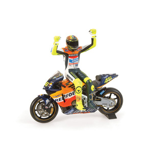 Minichamps has announced a 1/12 riding figure of Valentino Rossi side-saddling his Honda RC211V as h