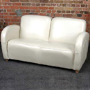 The Rotana cream leather sofa suite features a combination of curved and straight lines to give