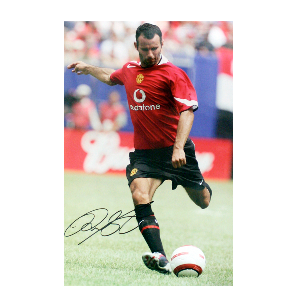 This signed Ryan Giggs photograph shows Giggs in action for Manchester United.The print is 15` x 10`