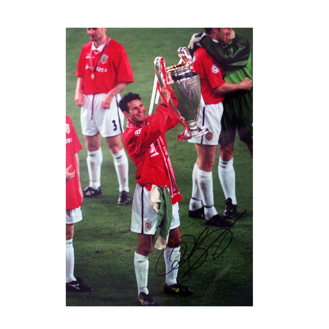 This signed Ryan Giggs photograph shows Giggs lifting the European Cup in 1999. In an almost perfect