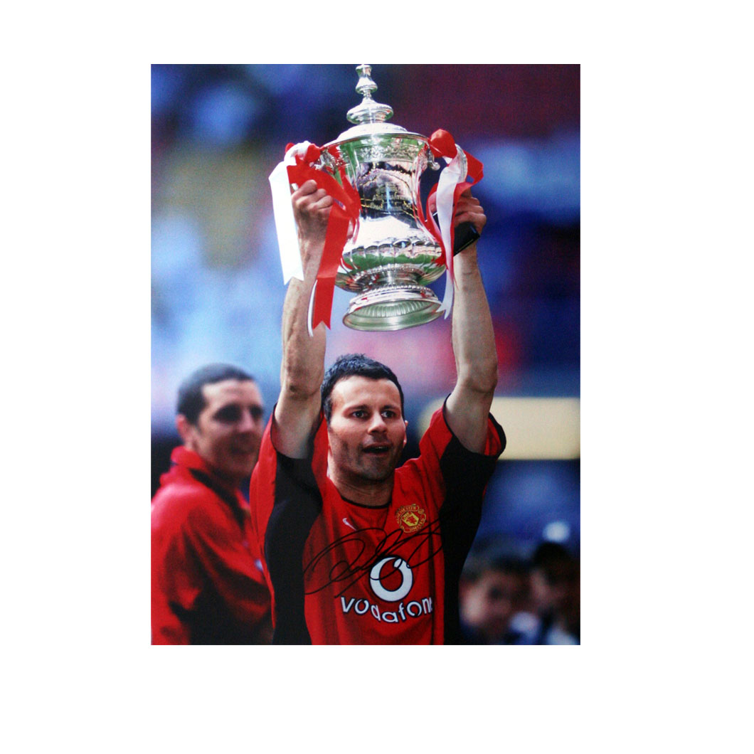 This print shows Giggs holding aloft the FA Cup after victory for Manchester United in the 123rd fin