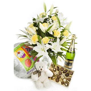 HT06 Standard Sassy handtied of White lilies and Yellow Roses is delivered with a SD03 160g box of c