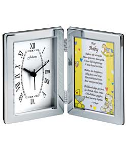 Silver colour metal case.Black hands.Quartz movement.Size (H)15, (W)23, (D)3 cm.Requires 1 x AA batt