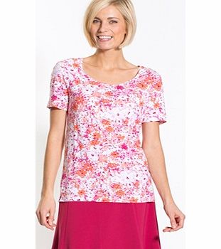 Short-Sleeved Floral T-shirt. A floral print that brings out all the charm of this ladies T-shirt... with success! It features a scoop neckline with gathers, short sleeves and side slits. 93% viscose, 7% elastane. Easy care machine washable. Length a