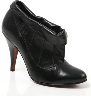 Almond toe leather ankle boot with pleat and cuff detail. The Shulie boot features a high stiletto h