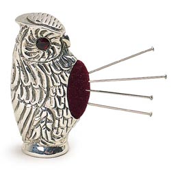 A pair of wise old owls, one for needles and one a