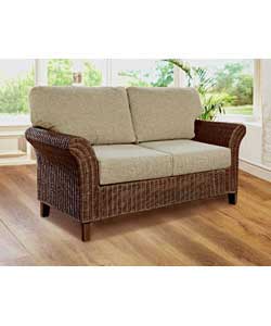Solaria has an attractive woven rattan frame featuring wing style arms and an upholstered back. Cush