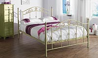 Elegantly styled romantic metal bedstead in an antique fossil stone finish with gold effect