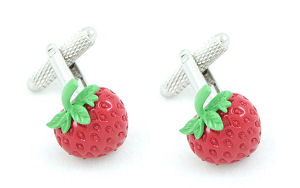 A cute pair of strawberry cufflinks.