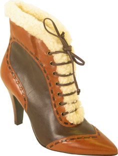 Stirty pointed toe lace up leather ankle boot. Featuring a high stack heel, brogue detail and faux f