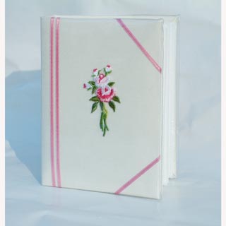 Lovely little photo album with an embroidered flower on the front.  Holds 80 6 x 4 photos - great