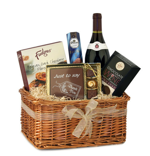 Send the perfect gift to show your appreciation. This wicker gift basket includes: `Thank You` theme