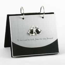 An album with a difference. The album will stand when opened out and then the front flips over to