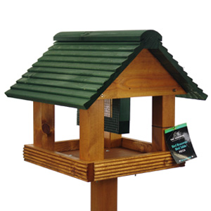This bird table is crafted from hard-wearing Swedish Redwood with a green pitched roof and heavy dut