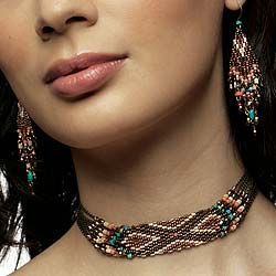 Inspired by the jewellery created by Zulu women. The woven coral, turquoise, wood and glass beads