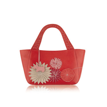 Description  Brilliantly bold applique flowers hand-crafted from suede and leather swirl gaily on th