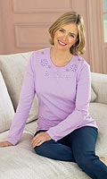 Jersey top with sequin and embroidery detail at neck. Washable. 95% cotton, 5% elastane