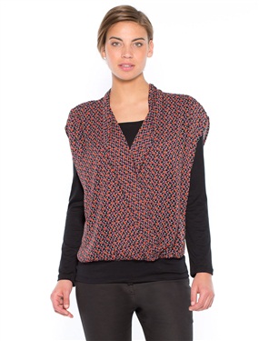 Youre sure to love this 2-in-1 blouse thats feminine and easy to wear with its own built-in T-shirt Sleeveless printed voile wrapover style blouse. 100% polyester. Gathered details on the shoulders and below the back yoke. Stitched at the hem of the 