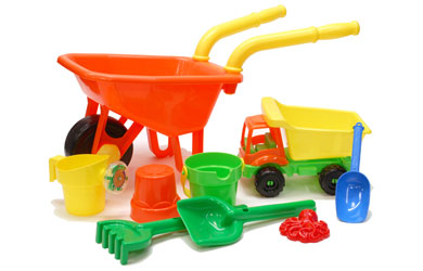 Colourful wheel barrow set which includes wheel barrow, truck, shovel, two buckets, jug, sand mould,