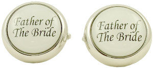 A great set of silver-coloured metal cufflinks with the words Father Of The Bride in black on a whit