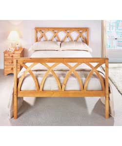 Wooden bedstead in antique pine colour.Comfort sprung mattress.Overall size (H)112, (W)144.5,