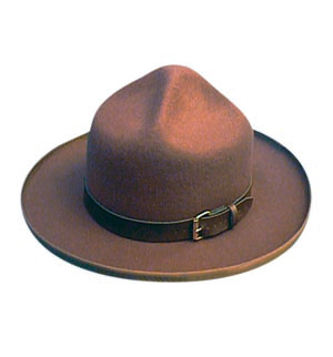 A brown mountie hat with belt buckle rim